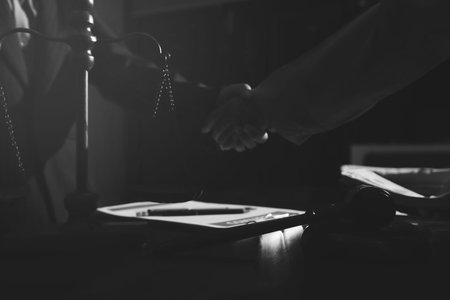 Consultation and conference of professional businesswoman and Male lawyers working and discussion having at law firm in office. Concepts of law, Judge gavel with scales of justiceの写真素材