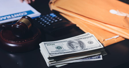 Consultation and conference of professional businesswoman and male lawyers working and discussing at law firm in office. Concepts of law, judge gavel with scales of justiceの写真素材