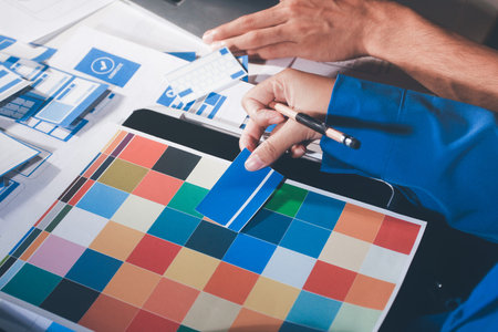 UXUI design brainstorming session with sketches and digital toolsの写真素材