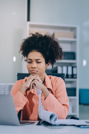 Businesswoman get stressed and headache while having a problem at work in officeの写真素材