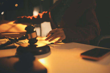 Close up of businessmen or lawyers discussing contract or business agreement at law firm office,...