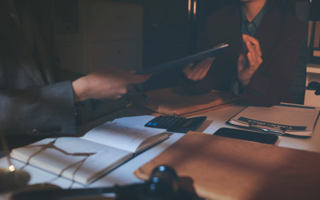 Close up of businessmen or lawyers discussing contract or business agreement at law firm office,...