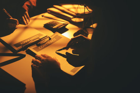 Close up of businessmen or lawyers discussing contract or business agreement at law firm office,...