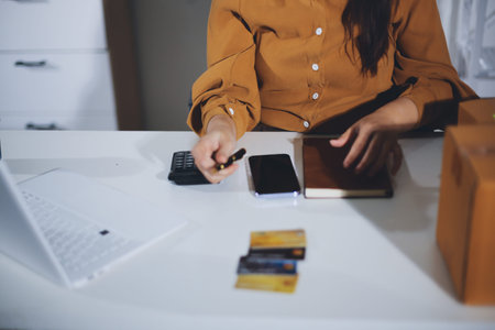 Online payment, Hands of woman holding a credit card and using smart phone for online shopping