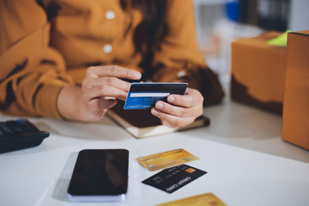 Online payment, Hands of woman holding a credit card and using smart phone for online shopping
