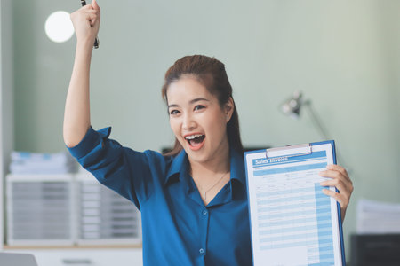 Young Asian businesswoman giving presentationの写真素材