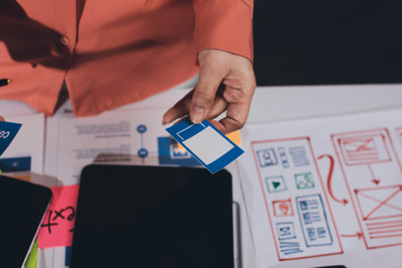 team of UI UX web designer are working together to develop mobile responsive websites with UI UX...