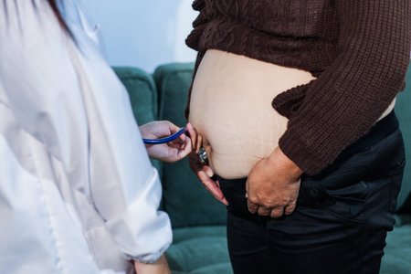 cropped shot of doctor examining pregnant woman during medical consultation