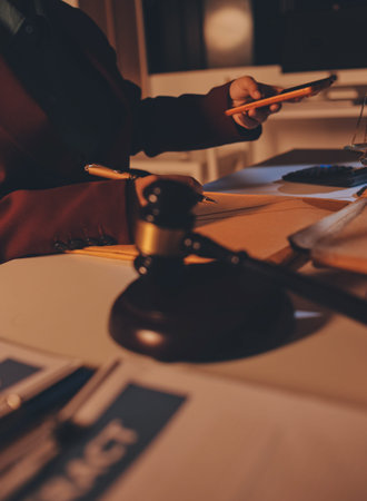Close up of businessmen or lawyers discussing contract or business agreement at law firm office,...