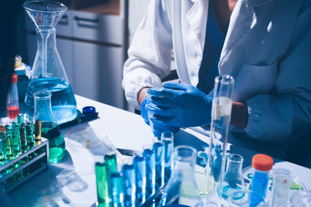 Science, laboratory and woman with pipette, test tube and biotech solution in research. Medical...