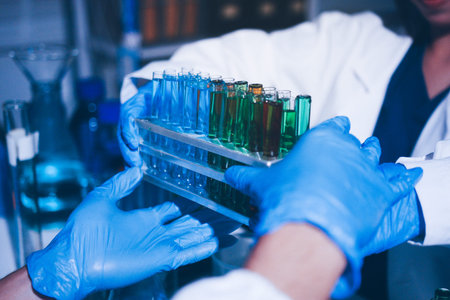Science, laboratory and woman with pipette, test tube and biotech solution in research. Medical...