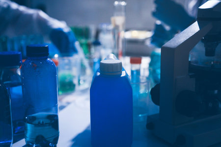 Science, laboratory and woman with pipette, test tube and biotech solution in research. Medical...