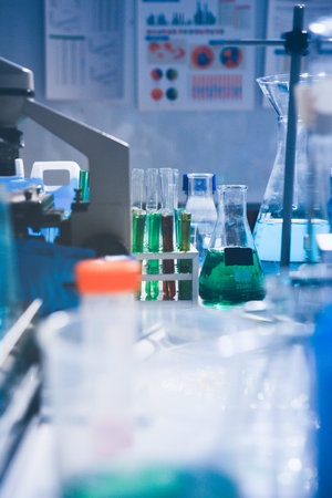 Science, laboratory and woman with pipette, test tube and biotech solution in research. Medical innovation, scientist or lab technician in study for healthcare, medicine and vaccine results feedback.の写真素材