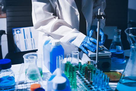 Science, laboratory and woman with pipette, test tube and biotech solution in research. Medical...