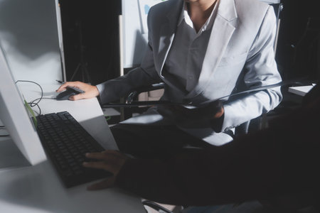 business people or accountant using calculator while working analytical business report on the...