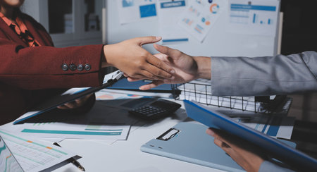 Business people shaking hands closing a deal