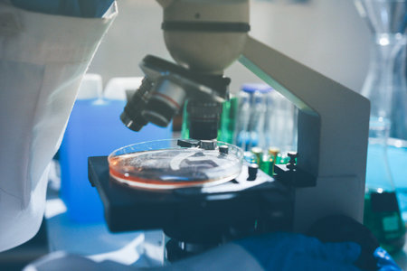 Science, laboratory and woman with pipette, test tube and biotech solution in research. Medical...