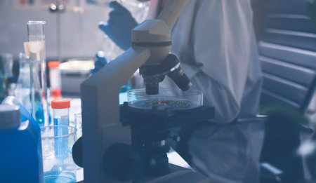 Science, laboratory and woman with pipette, test tube and biotech solution in research. Medical...