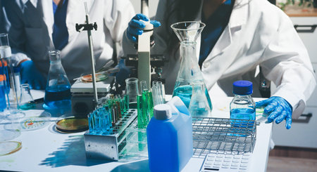 Science, laboratory and woman with pipette, test tube and biotech solution in research. Medical...
