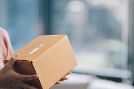 Starting small businesses SME owners female entrepreneurs check online orders to prepare to pack the boxes, sell to customers, sme business ideas online.の写真素材