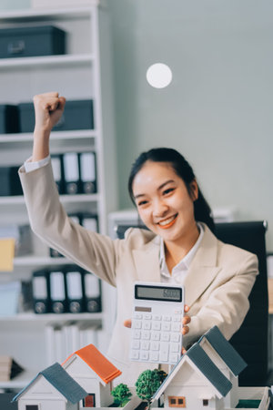 real estate agent home miniature model on documents sale and purchase of apartment notarial deedの写真素材