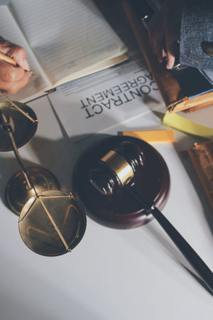 Businesswoman and Male lawyer or judge consult and conference having team meeting with client at law...