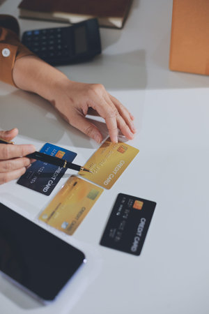 Online payment, Hands of woman holding a credit card and using smart phone for online shopping