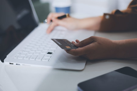 Online payment, Hands of woman holding a credit card and using smart phone for online shopping