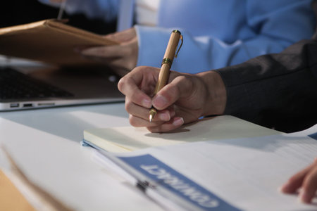 Consultation and conference of professional businesswoman and Male lawyers working and discussion having at law firm in office. Concepts of law, Judge gavel with scales of justiceの写真素材