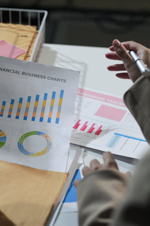 Business woman accountant working in office checking financial accounts and allocating company...
