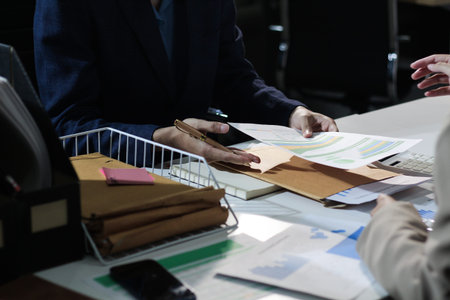 Business woman accountant working in office checking financial accounts and allocating company budgets.の写真素材