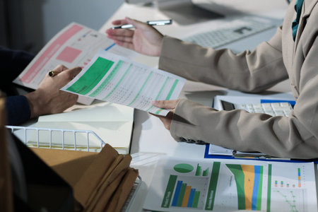 Business woman accountant working in office checking financial accounts and allocating company...