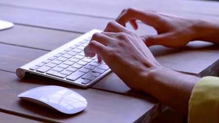 Hands are writing on a keyboardの写真素材