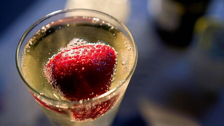 Strawberry in a glass of Champagneの写真素材