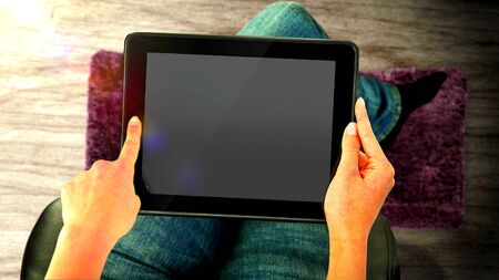 Seated woman with a tablet