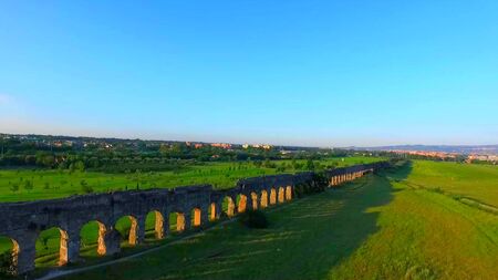 A big evening sun on ancient vestige of Italy in Europeの写真素材