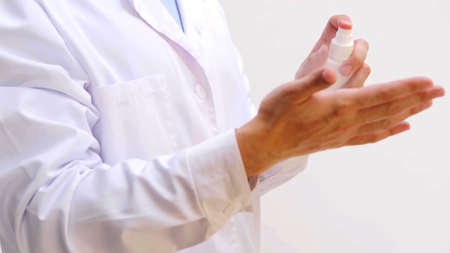 A focus of a doctor who is using an hydroalcoholic gelの写真素材