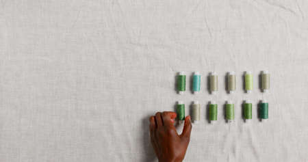 A background photo with sewing thread spools