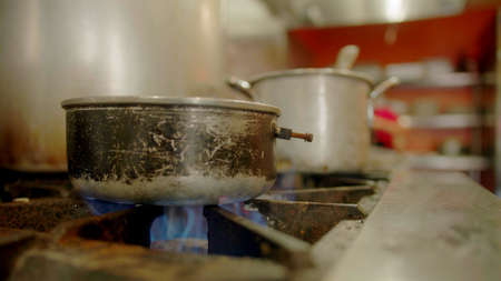 Old pan in a kitchen of a restaurantの写真素材