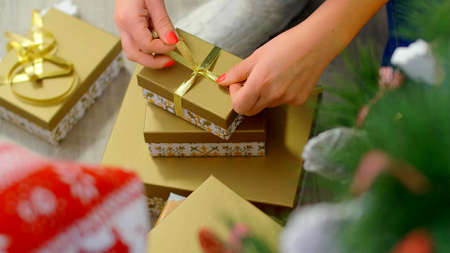 Hands of a woman who is making a present