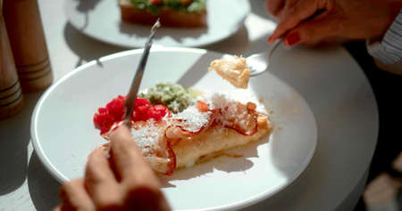 Hands of a woman who is eating a mealの写真素材