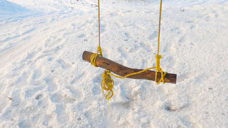 Close-up on a swing during the winter