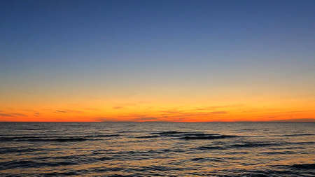 A background photo with the ocean and the skyの写真素材