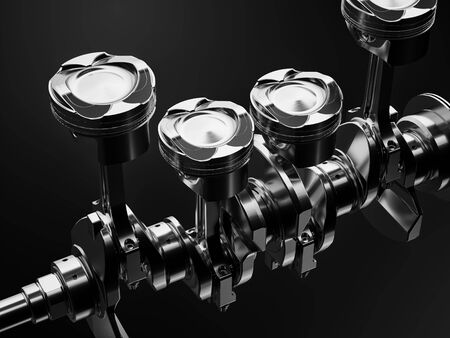 Shiny car pistons on a black background with studio lighting