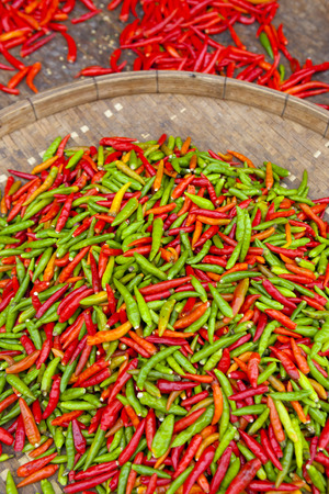 red and green chili paper on market standの写真素材