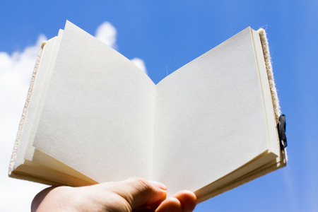open book and sky backgroundの写真素材
