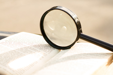 Magnification glass over a opened book