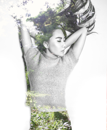 Double exposure of asian woman and natureの写真素材