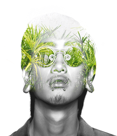 Double exposure of asian guy with glasses and nature