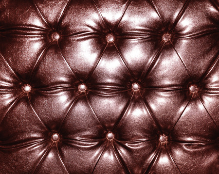 Luxurious marsala color leather texture furniture with buttons, upholstery